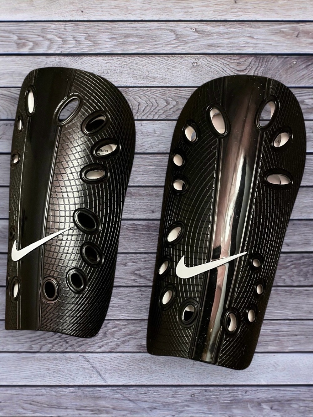 Nike Men’s Black Shin Guards with White Swoosh
